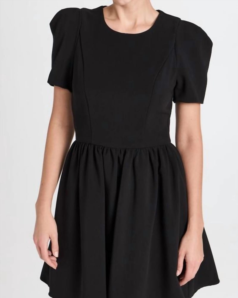Front of a model wearing a size 10 Chadwick Mini Dress In Black in Black by Black Halo. | dia_product_style_image_id:346211
